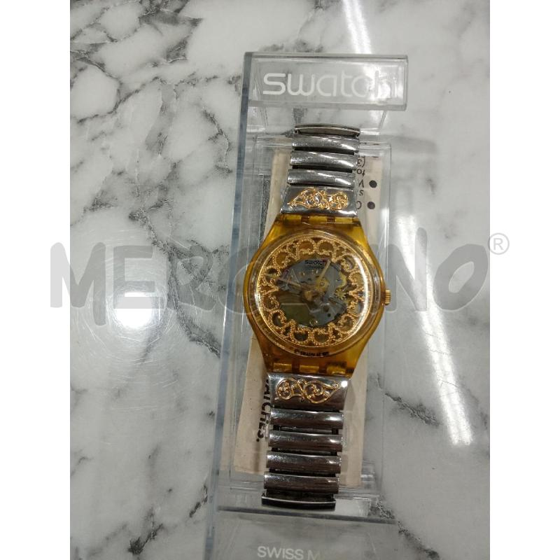 OROLOGIO DA POLSO GRIGIO E GIALLO, QUADRANTE TRASPARENTE, SWATCH VINTAGE | Mercatino dell'Usato Benevento 1