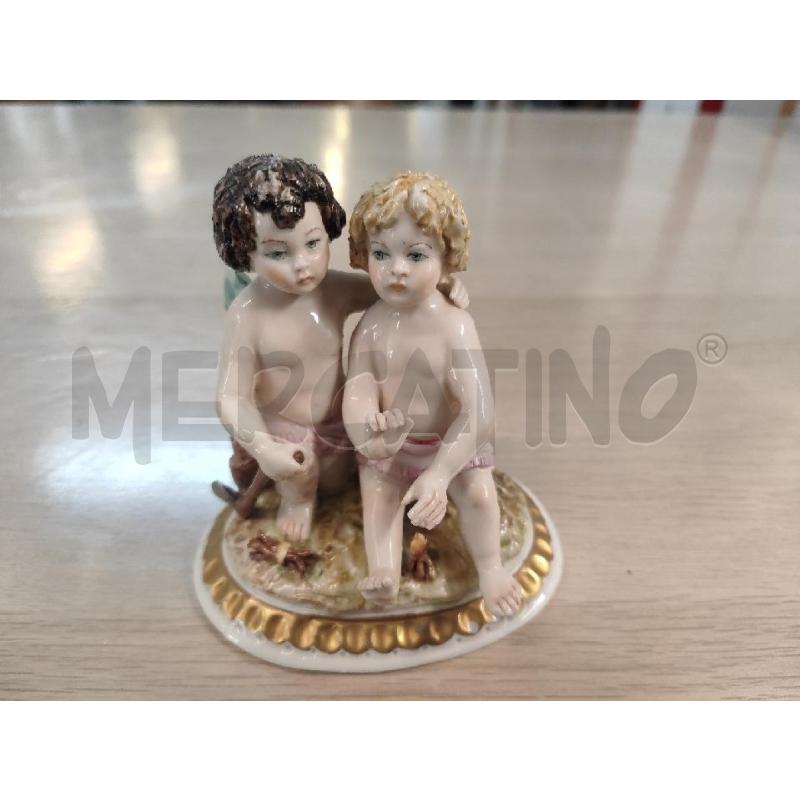 STATUETTA COPPIA PUTTINI CAPODIMONTE CON ASCIA | Mercatino dell'Usato Vinci - fraz. sovigliana 1