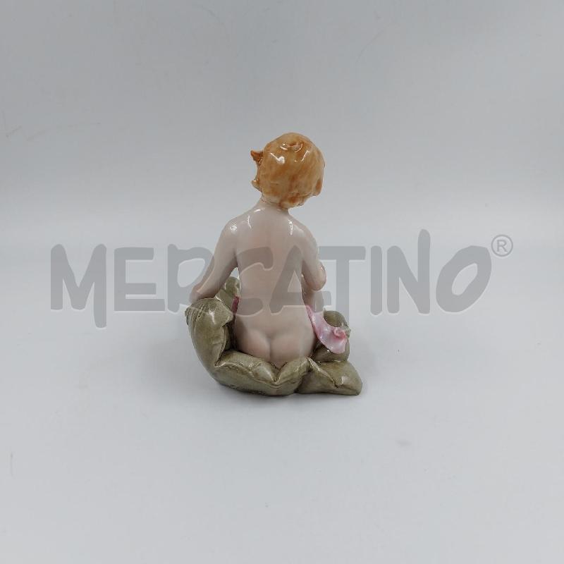 STATUINA BIMBA SU CUSCINO CAPO  | Mercatino dell'Usato Genova sampierdarena 3