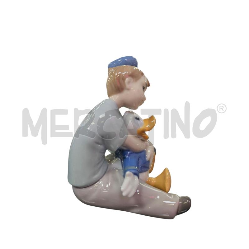 STATUINA NAO BAMBINO SOGNANTE CON PAPERINO | Mercatino dell'Usato Roma appia 3
