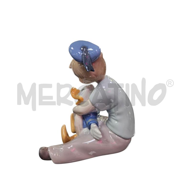 STATUINA NAO BAMBINO SOGNANTE CON PAPERINO | Mercatino dell'Usato Roma appia 4