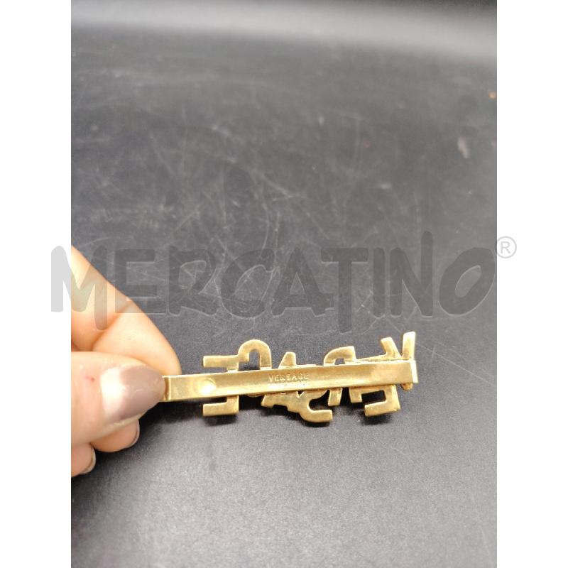 MOLLETTA VERSACE SCRITTA DOR BRILL | Mercatino dell'Usato Roma eur 2